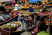 Thailand, Locals sell fruits, food and products at Damnoen Saduak floating market near Bangkok 